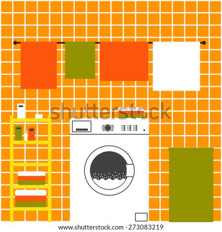 Orange laundry room interior with ceramic tile wall, front loading type washing machine, laundry basket, drying towels and shelving with clean towels, packs of washing powder, bar of soap
