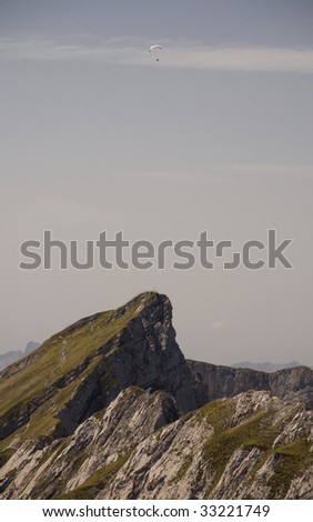 High above the land, a para glider in the European alp\'s