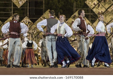 RIGA, LATVIA - July 4, 2013: The Latvian National Song and Dance Festival. Latvian dance grand performance at Our Fathers Piers
