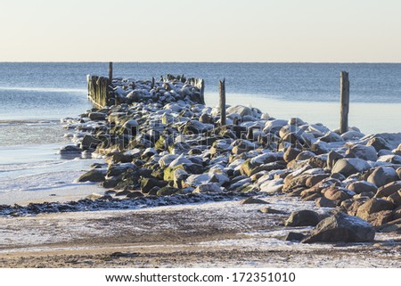A peaceful scene with old pier in winter