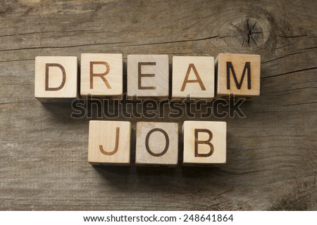 Dream Job text on a wooden background