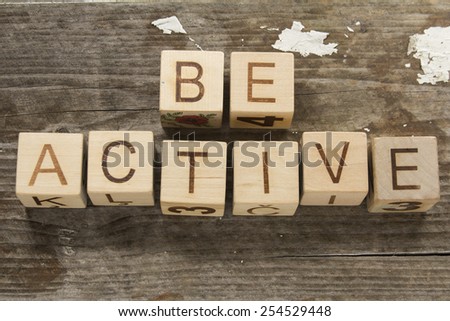 be active text on a wooden background