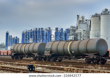 Image showing trains against an industrial background with factories pumping coal fumes into the atmosphere