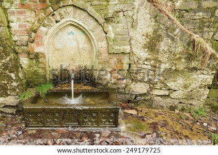 Stock image of a water well in the hills
