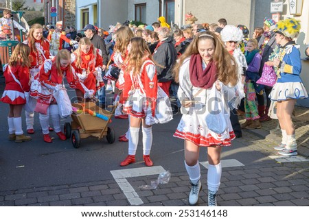 ERPEL, GERMANY 15 FEBRUARY 2015 - Unidentified persons celebrating a carnival procession to celebrate the end of Karneval season, an annual event held throughout certain regions in Germany