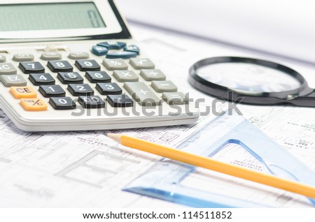 Blueprints, pencil, square drawing, magnifier and calculator against a  white background