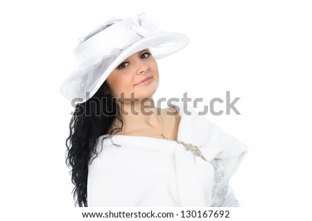 Portrait of young beautiful  white hat and white cape against white background