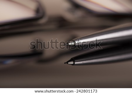 Mechanic crayon against a black glossy surface