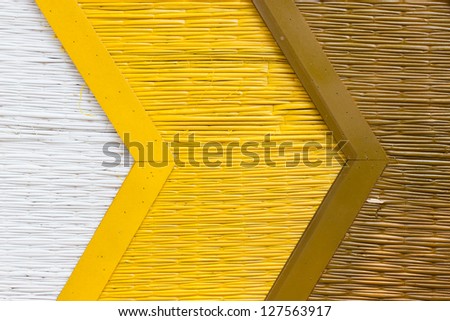 Bamboo mat background painting with white yellow and brown.