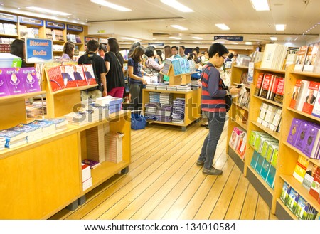 BANGKOK - MARCH 6 : Visitors choosing books on board of The Logos Hope the world\'s biggest floating book fair with 5000 book titles in Bangkok Thailand on 6 March 2013.