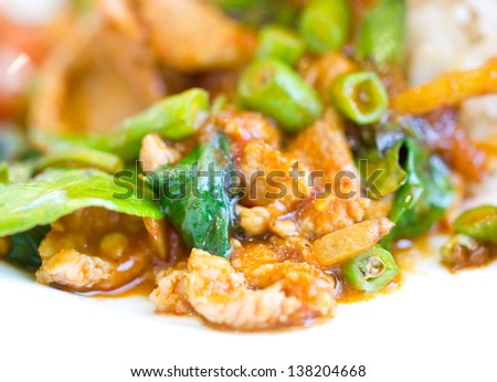 Spicy stir-fried pork with red curry paste.