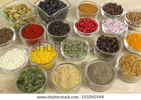 Spices and herbs in small glass bowls. Food and cuisine additives.
