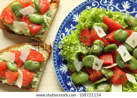 Sandwiches and broad beans salad with tomato and goat cheese