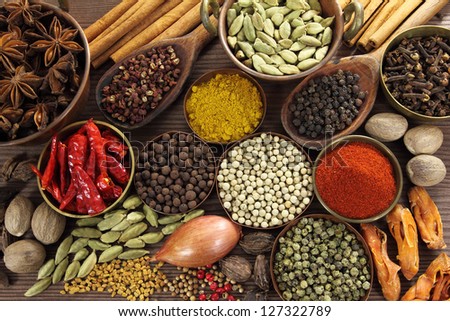 Spices And Herbs In Metal Bowls And Wooden Spoons. Food And Cuisine Ingredients.