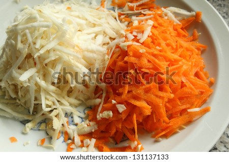 Grated apple and carrot on a plate