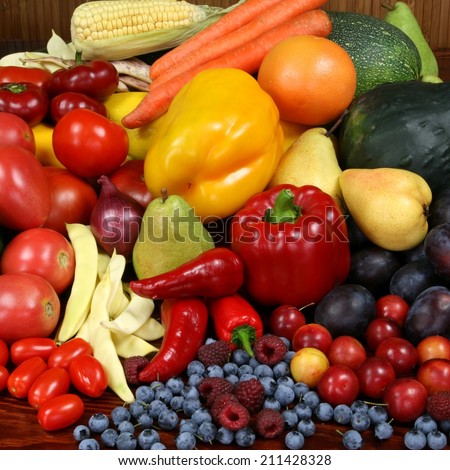 Delicious, colorful variety of fresh  fruits and vegetables. Square composition.