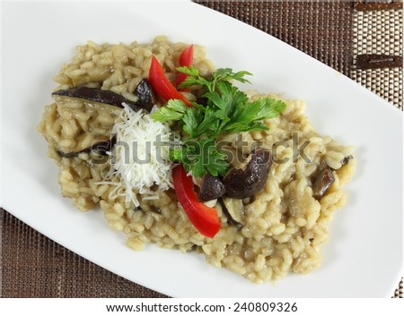 Risotto with mushrooms, with cheese and parsley.