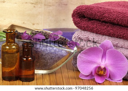 Spa relaxation composition - towels, orchid flower, bottles with lotions