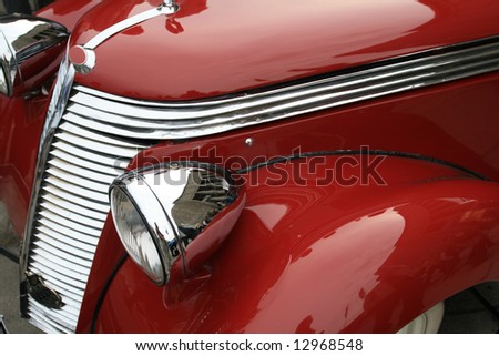 Vintage, shiny, red car. Classic luxury limousine. History of automobile.