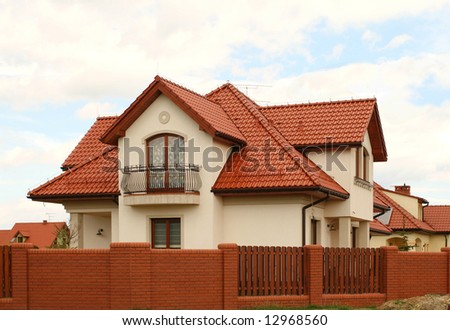 Yellow home with red tiled roof. Nice architecture.