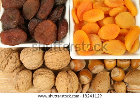 Walnuts, hazelnuts, pine nuts, dried peach fruit and almonds. Natural food.