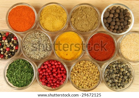 Spices and herbs in small glass bowls. Food and cuisine additives. Colorful natural ingredients.