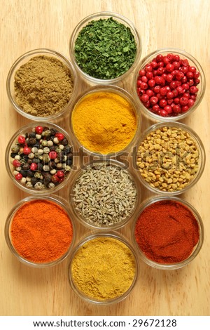 Spices and herbs in small glass bowls. Food and cuisine additives. Colorful natural ingredients.