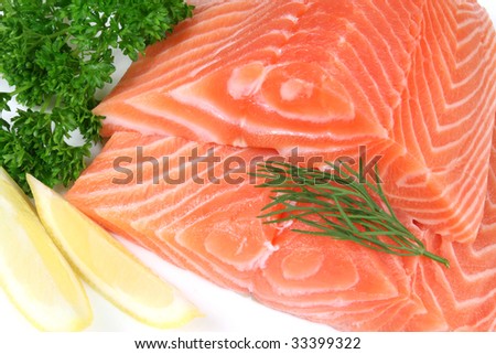Raw raw salmon with rosemary, parsley and lemon. Sea food.