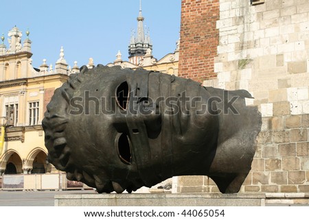 Human head sculpture in Krakow, Poland. Famous Market Square.