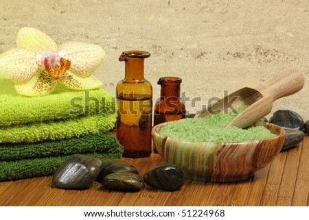 Spa resort composition - bath soap, towels, orchid flower, bottles with lotions
