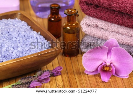 Spa relaxation composition - bath soap, towels, orchid flower, bottles with lotions