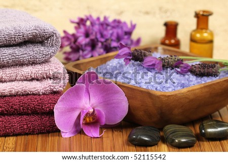 Relaxing spa resort composition - bath soap, towels, orchid flower, bottles with lotions