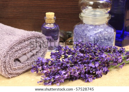 Relaxing spa resort composition - towels, lavender flower, bottle with lotion