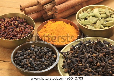 Spices and herbs in brass bowls. Food and cuisine ingredients. Colorful natural additives.