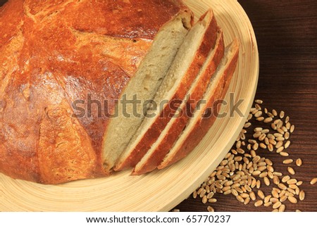Food and cuisine composition. Fresh baked Polish wheat-rye bread with grains of wheat.