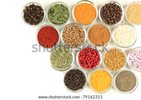 Spices and herbs in small glass bowls. Food and cuisine additives.