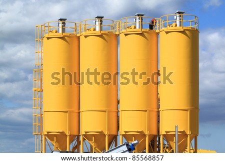 A group of processing silos of a concrete factory . Industrial structure