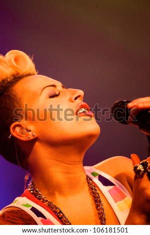 OSWESTRY, UK - JUNE 2: Courtney Rumbold from Stooshe singing on the main stage Saturday 2nd June 2012 at Osfest music festival, Oswestry Show ground, Oswestry, United Kingdom