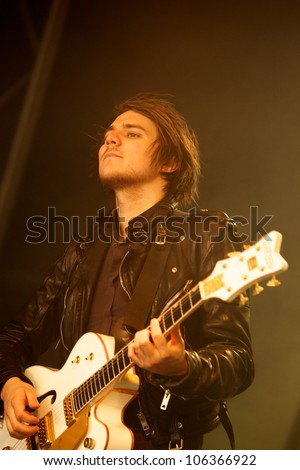 OSWESTRY, UK - JUNE 3: Mark Hayton lead guitarist from English band One Night Only playing guitar on the main stage Sunday 3rd of June 2012 at Osfest music festival,  Oswestry, United Kingdom