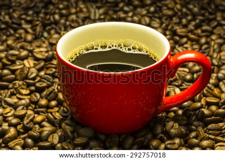 Red Coffee cup and coffee beans