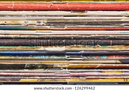 Closeup view of old magazines pile end, maybe used as background