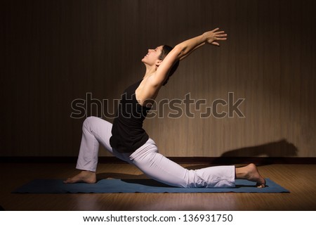 Yoga woman practising her strength and balance, healthy lifestyle, fitness and sport exercise