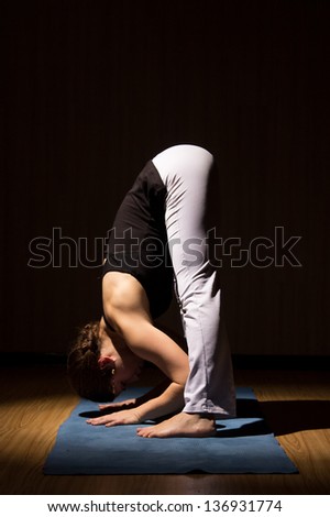 Yoga woman practising her strength and balance, healthy lifestyle, fitness and sport exercise