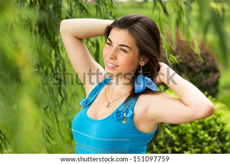 Beautiful teenager girl with freckles feel happy in green nature park, close up portrait of woman freckle face