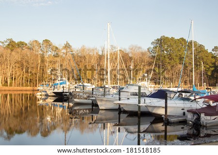 Luxury yachts on an anchor in harbor or marine. Beautiful view of boats at sunset