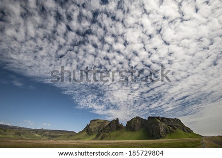 Vik, Iceland Altocumulus clouds formation above a mountain /Clouds and mountain in Iceland/Interesting cloud formation above a mountain in southern Iceland, close to Vik