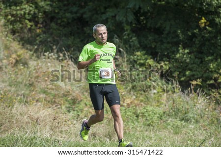 Ramnicu Valcea, Romania, August 30, 2015. Running down hill/ Man running down hill during the cross trail competition within Oltenia\'s Marathon event.