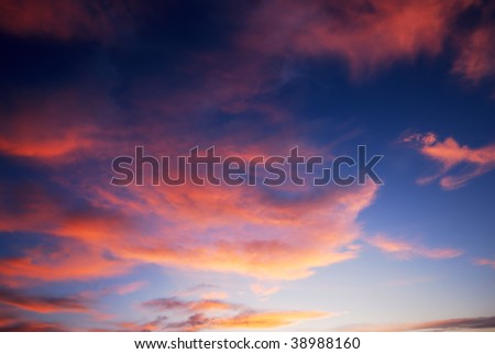 Dark red sunset clouds and deep blue sky