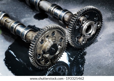 cam shaft of a turbo diesel engine on a dark background