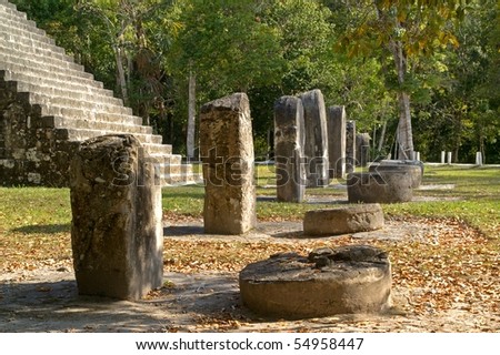 Row of altar stones in front of a contemporary Maya temple,Tikal Peten National Park, Guatemala, A UNESCO World Heritage Site